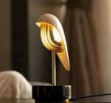 Black  marble and gold  unique alarm clock that uses nature sounds, bird calls, and soft ambient light to give users a refreshing and energizing start to their morning. It uses one-touch audio transmission to set the time and alarms without a network or Bluetooth needed.