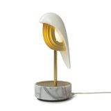 White marble and gold  unique alarm clock that uses nature sounds, bird calls, and soft ambient light to give users a refreshing and energizing start to their morning. It uses one-touch audio transmission to set the time and alarms without a network or Bluetooth needed.